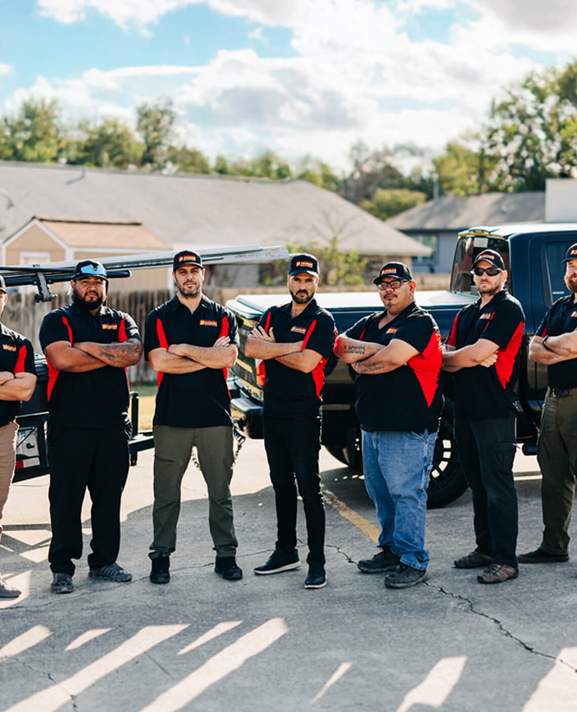 Garage Door Masters crew in front of a service truck