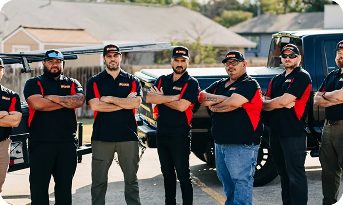 Garage Door Masters team in front of their service trucks